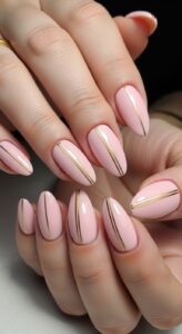 10. Soft Pink Nails with Gold Lines