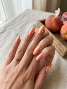 1. Glazed Peach Chrome Nails